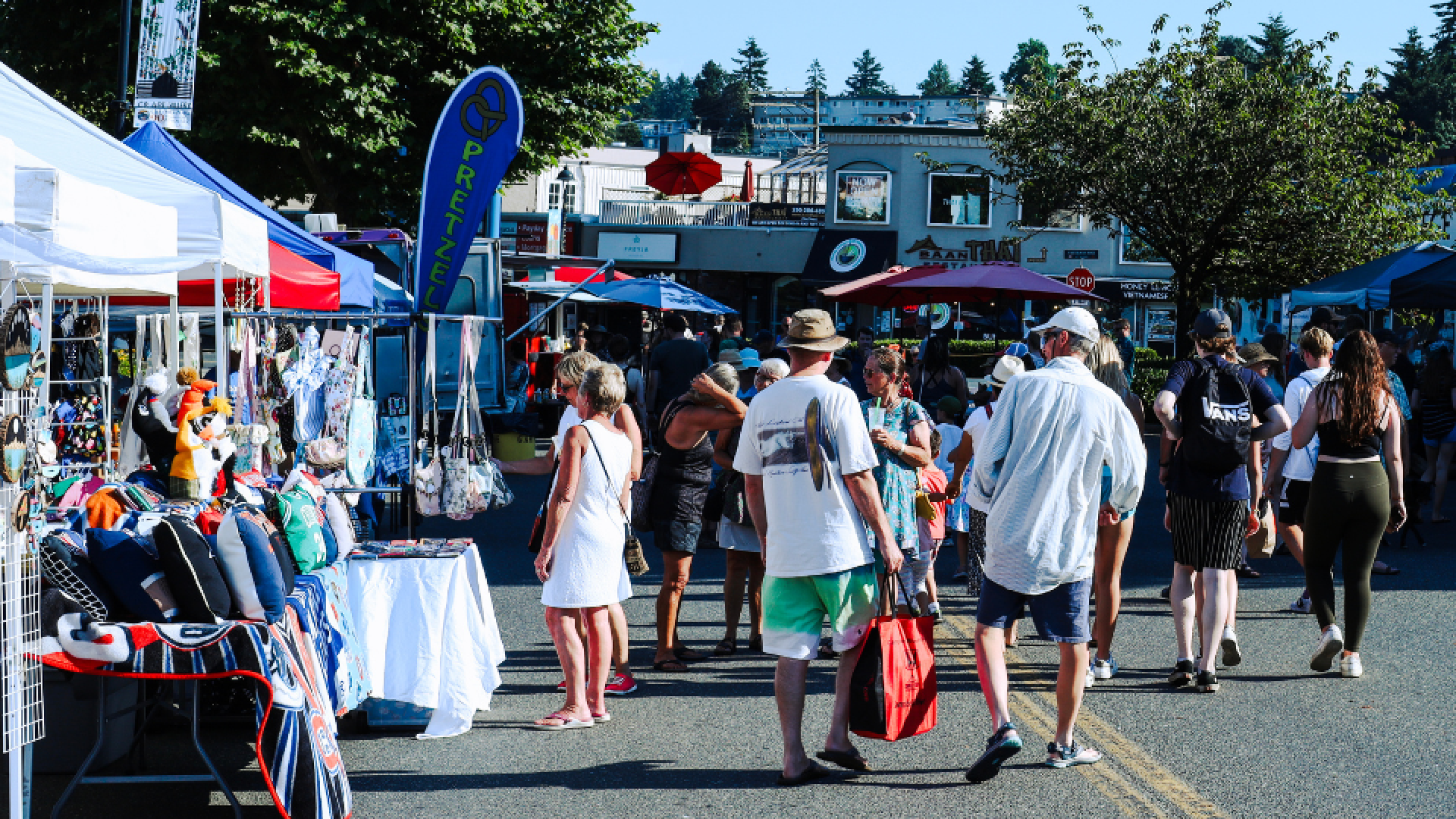 People gather on a closed downtown Campbell River street shopping local venders.