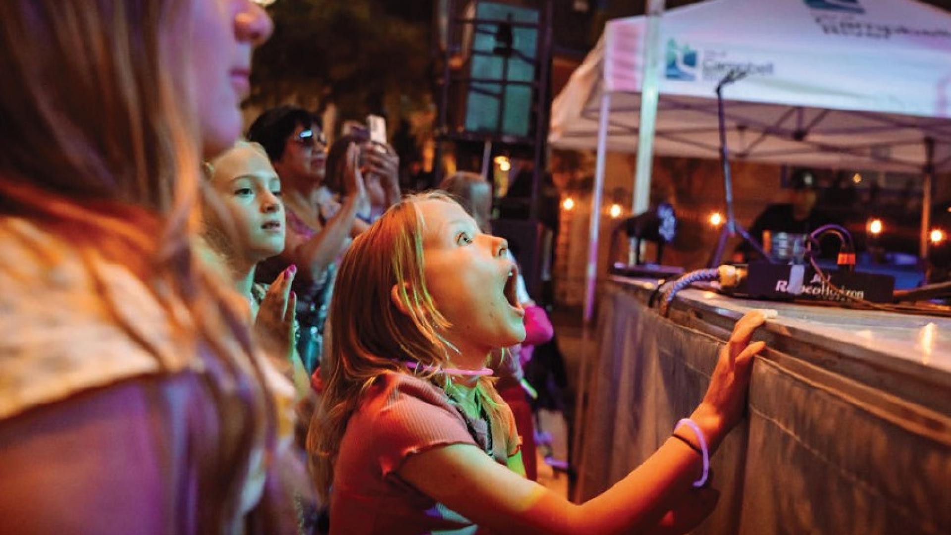 An enthusiastic fan watches on
