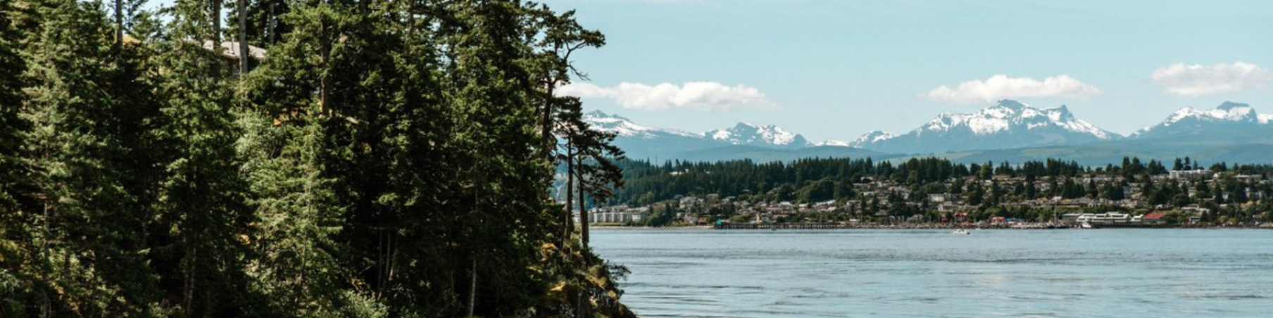 View of Campbell River with mountains in the background and the ocean in the foreground