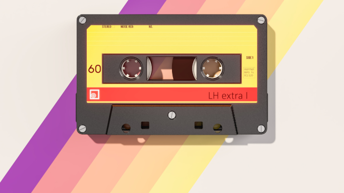 Cassette tape with a rainbow of purple, pink, orange and yellow behind.