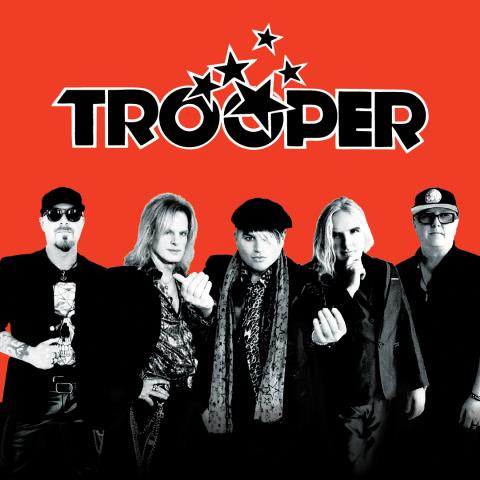 Promotional poster for the band Trooper. The poster has a red background. A black and white photograph of the band members is at the bottom of the poster, beneath the band's logo.