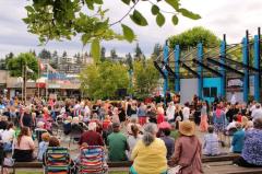Residents eagerly gather to watch the performers light up the Spirit Square stage.