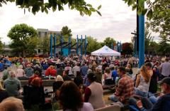 Residents eagerly gather to watch the performers light up the Spirit Square stage.